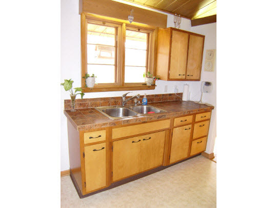 3117 Spring Creek Road Rockford, IL 61107 - Photo 4 of 11 a bathroom with a granite countertop sink and a window