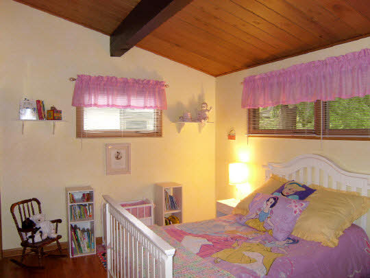 3117 Spring Creek Road Rockford, IL 61107 - Photo 7 of 11 a bedroom with a bed and a window