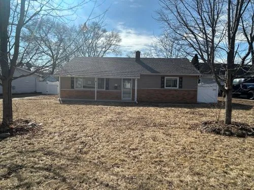 front view of a house with a yard