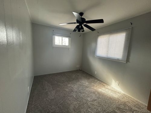 245 Robinson Drive Morris, IL 60450 - Photo 4 of 12 an empty room with windows and fan