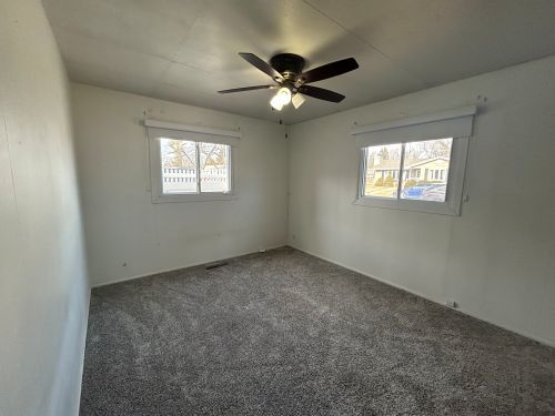 245 Robinson Drive Morris, IL 60450 - Photo 5 of 12 an empty room with a window and a fan