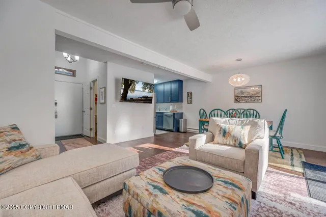 a dining room with furniture and wooden floor