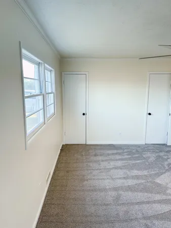 a view of hallway with wooden floor