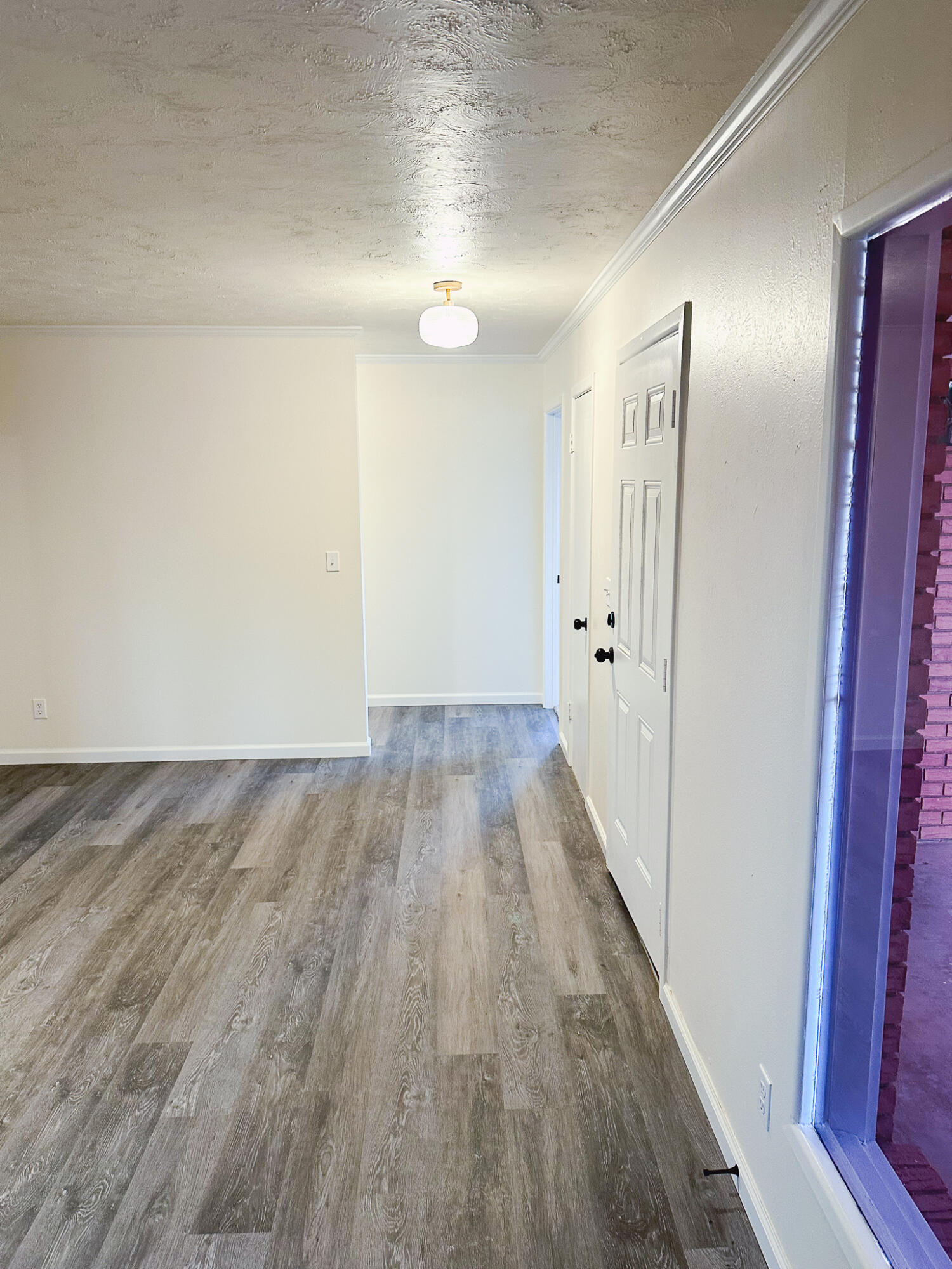 102 Northeast 25th Street Lamesa, TX 79331 - Photo 20 of 32 a view of hallway with wooden floor