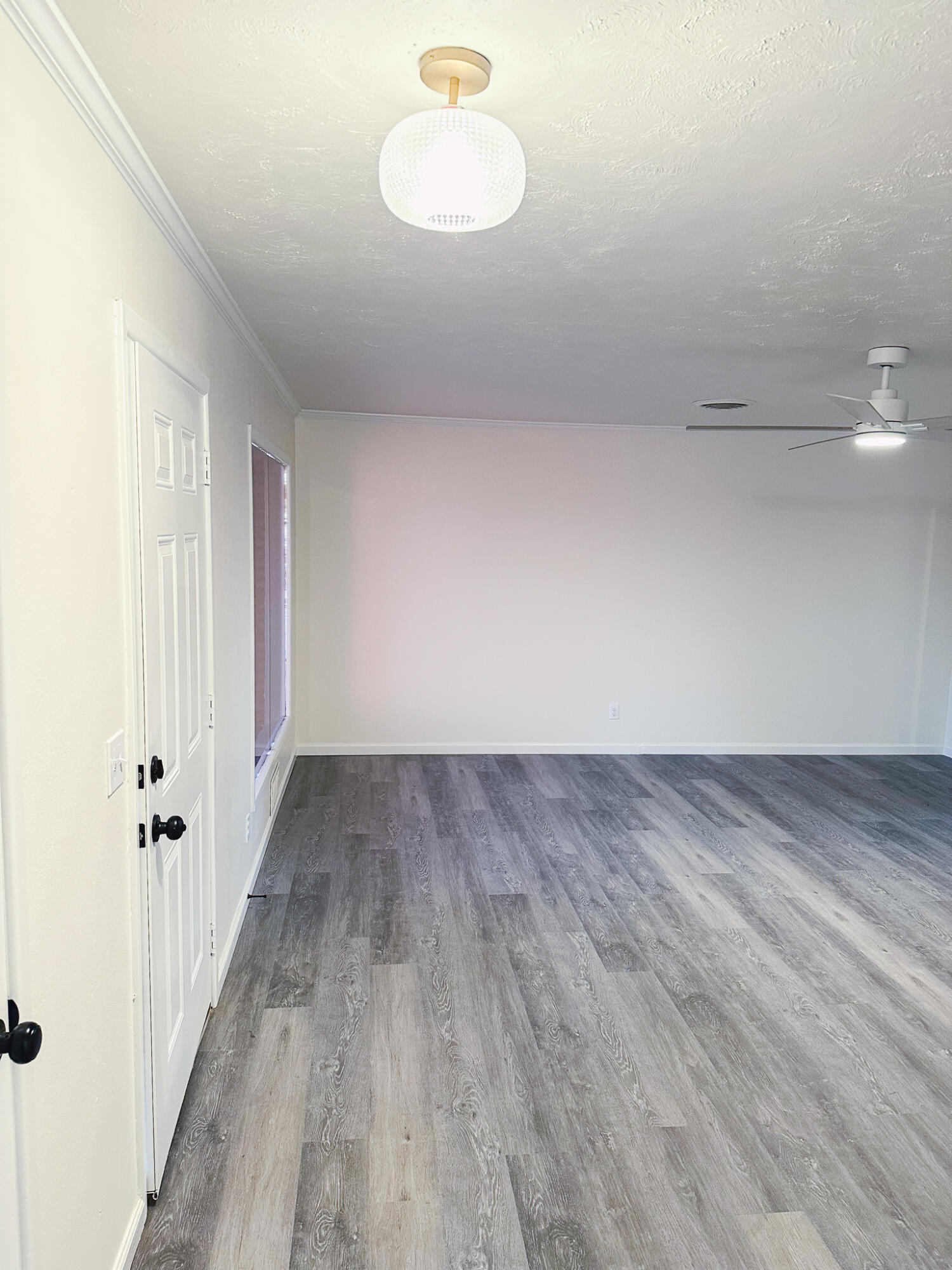 102 Northeast 25th Street Lamesa, TX 79331 - Photo 22 of 32 a view of a room with wooden floor