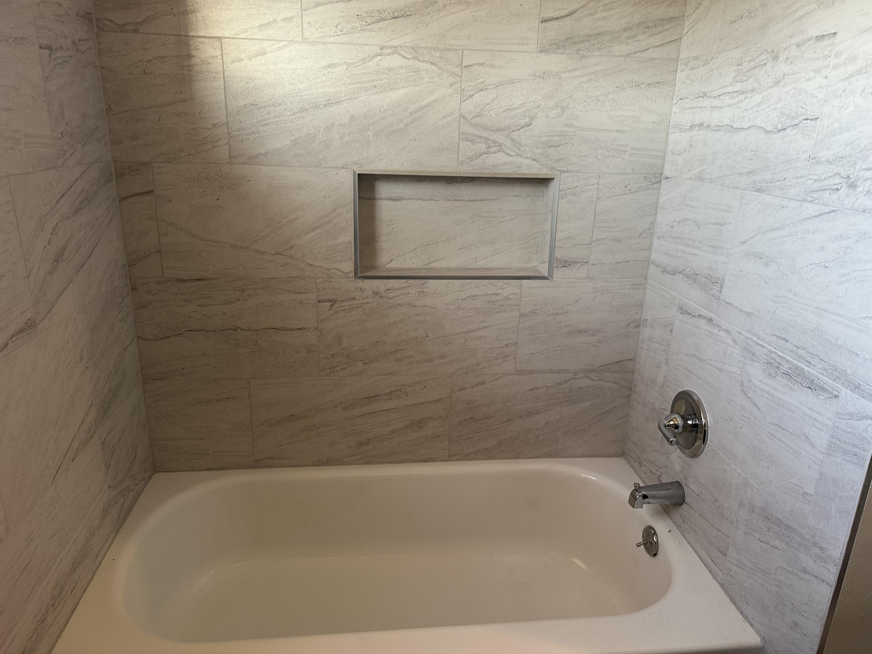 102 Northeast 25th Street Lamesa, TX 79331 - Photo 25 of 32 a close up of a bathtub in a bathroom