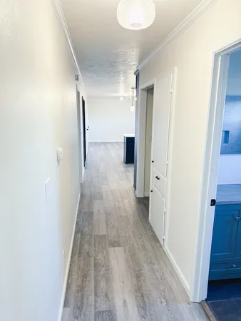 a view of room with wooden floor