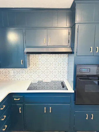 a view of a room with an empty space & a window