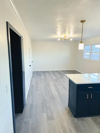 a spacious bathroom with a sink and a mirror