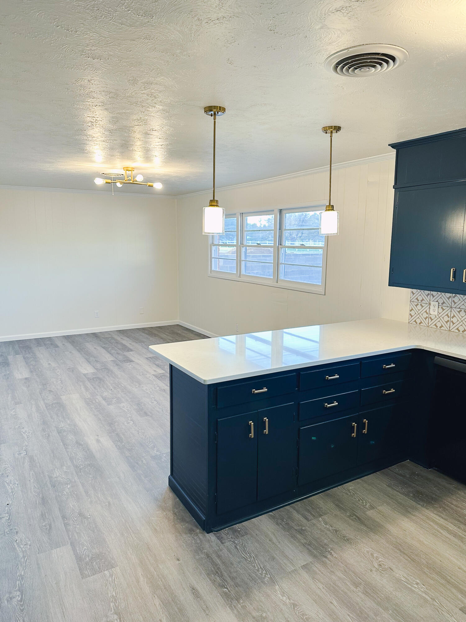 102 Northeast 25th Street Lamesa, TX 79331 - Photo 10 of 32 a spacious bathroom with a sink and a mirror