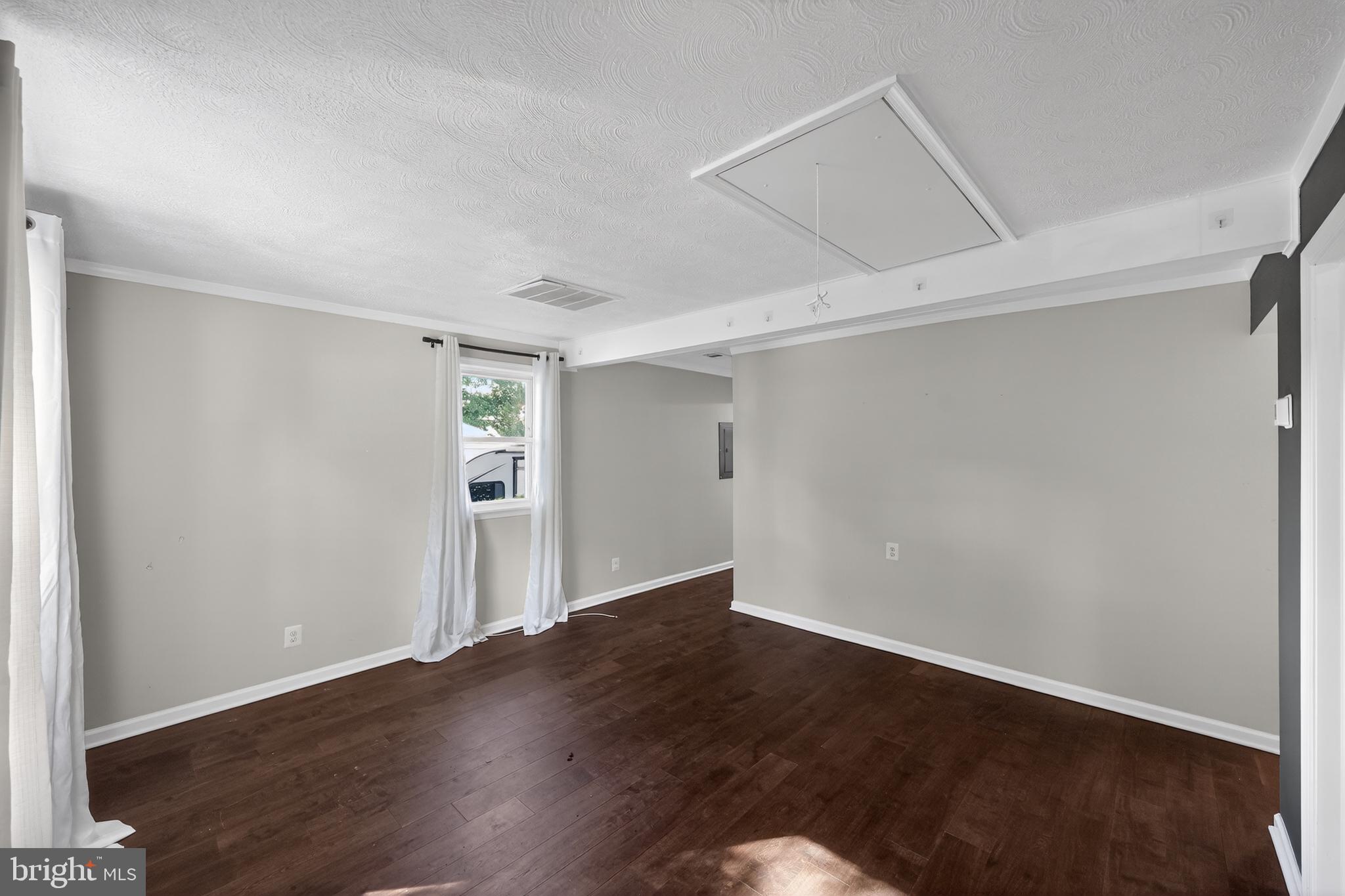 3670 5th Avenue Edgewater, MD 21037 - Photo 4 of 60 a view of an empty room with wooden floor
