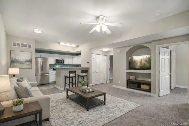 a living room with furniture and a window