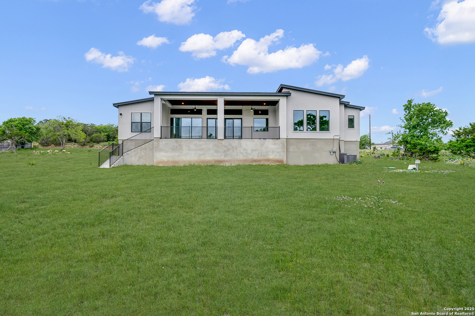 6846 Spring Branch Road Spring Branch, TX 78070 - Photo 16 of 46 a front view of house with a garden