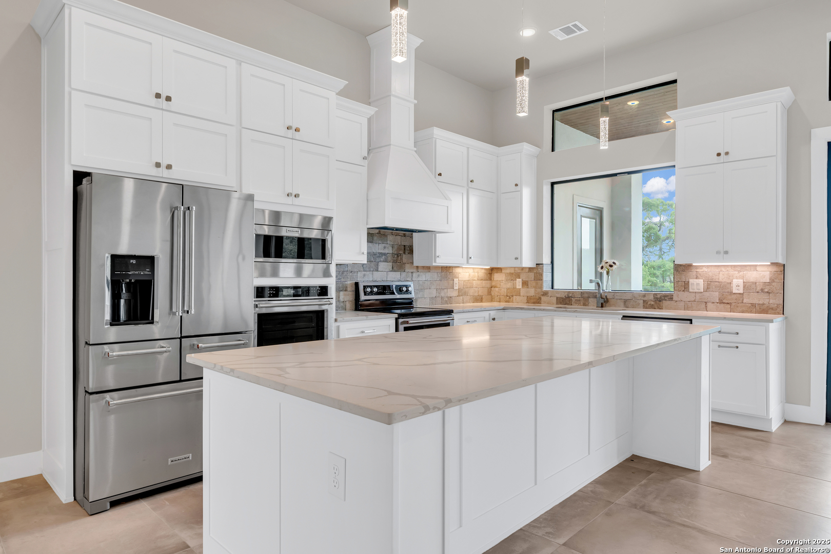6846 Spring Branch Road Spring Branch, TX 78070 - Photo 19 of 46 a kitchen with stainless steel appliances granite countertop a refrigerator sink stove and white cabinets