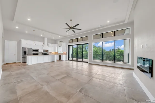 a large kitchen with cabinets and stainless steel appliances