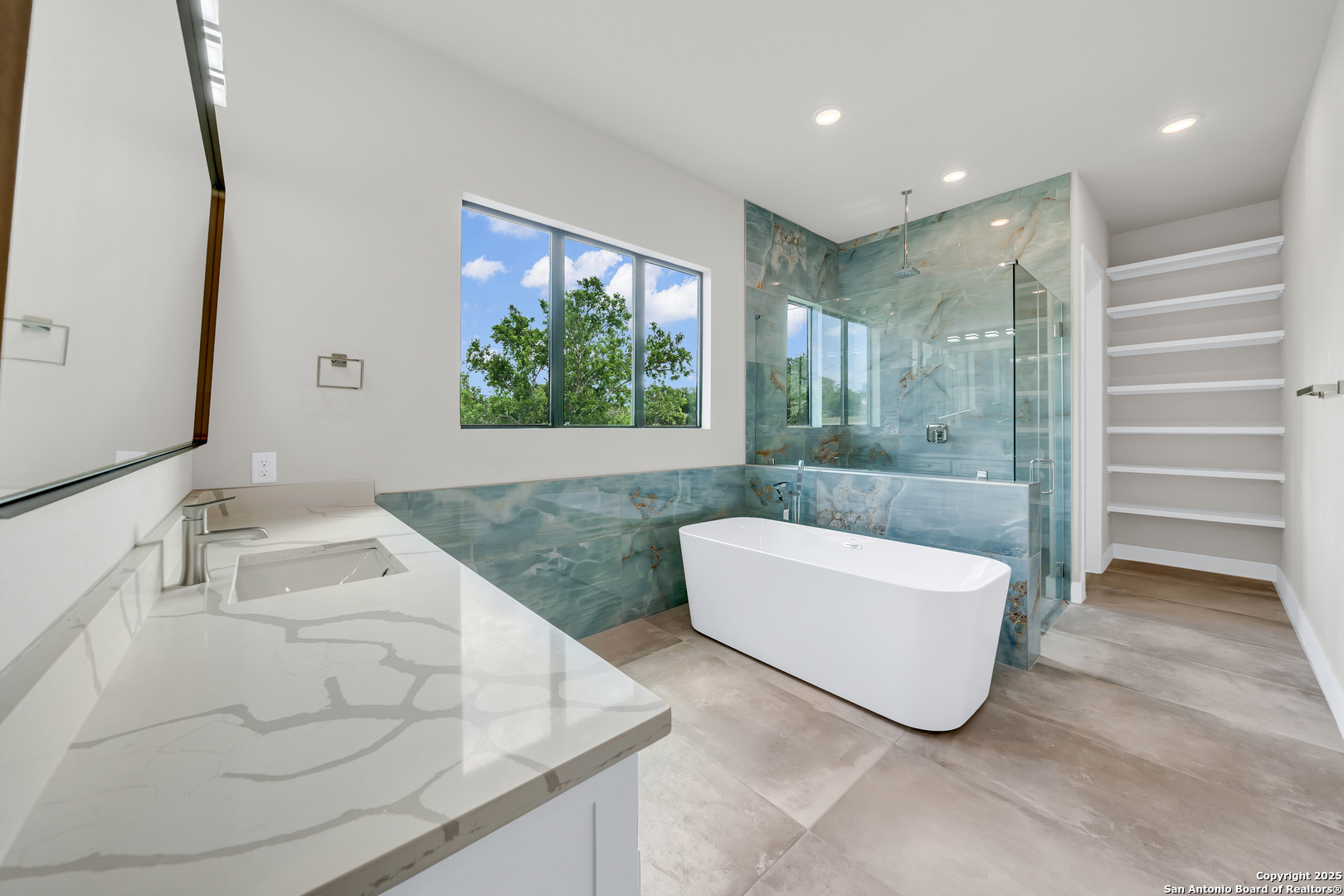6846 Spring Branch Road Spring Branch, TX 78070 - Photo 31 of 46 a bathroom with a bathtub sink and mirror