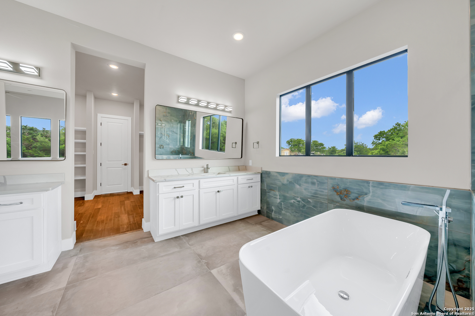6846 Spring Branch Road Spring Branch, TX 78070 - Photo 33 of 46 a bathroom with a sink a toilet and mirror