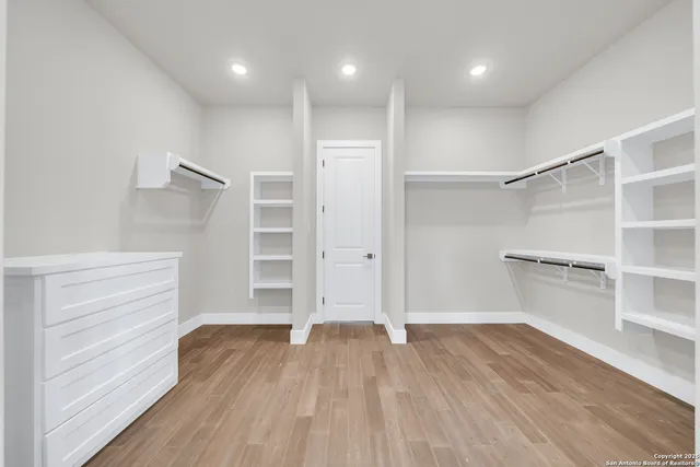 a utility room with a sink a vanity and a window
