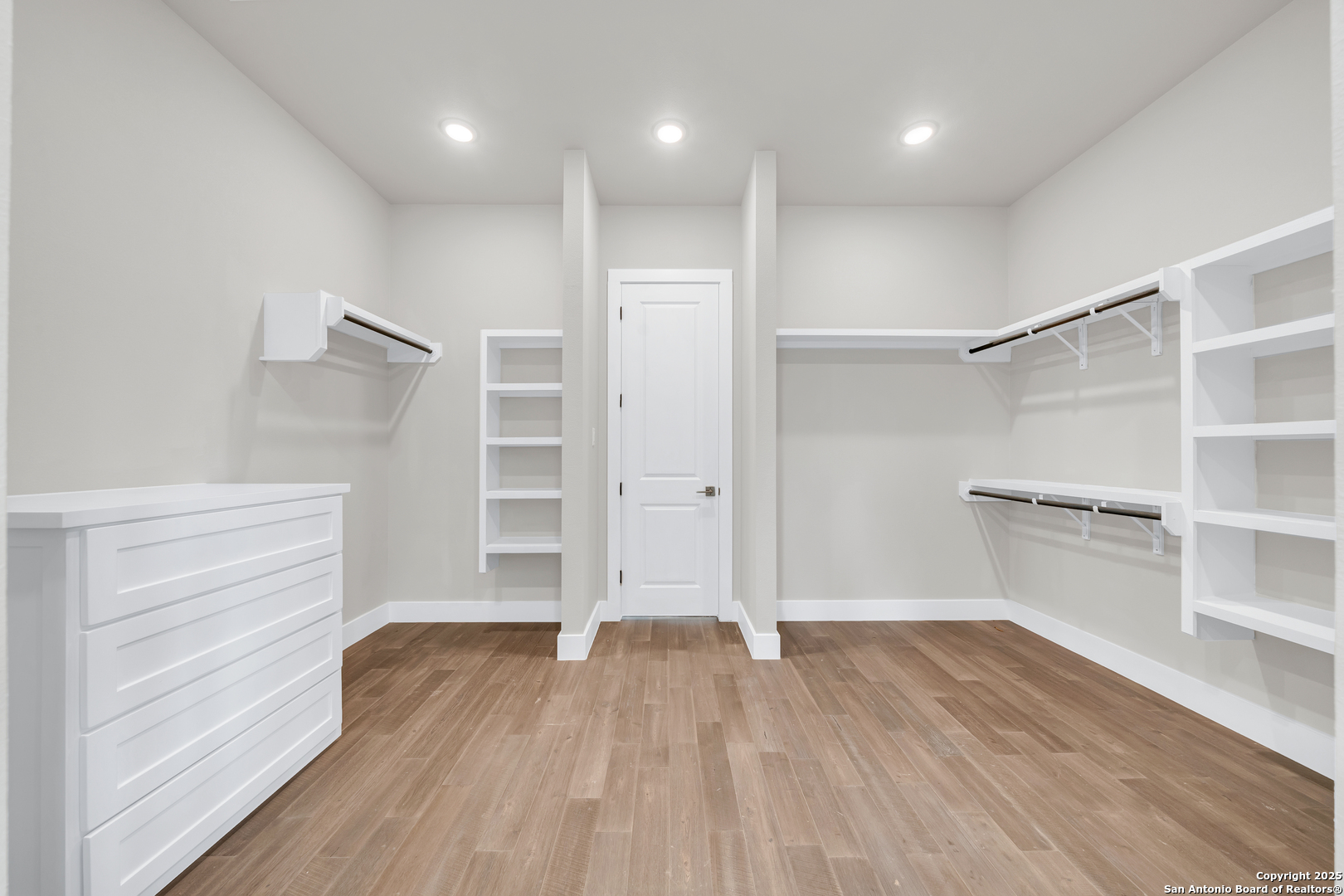6846 Spring Branch Road Spring Branch, TX 78070 - Photo 34 of 46 wooden floor in an empty room with a window