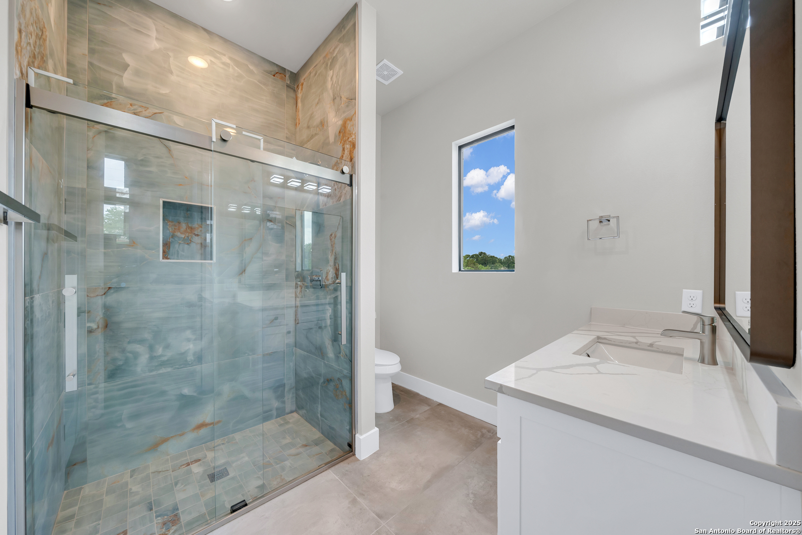 6846 Spring Branch Road Spring Branch, TX 78070 - Photo 37 of 46 a bathroom with a shower mirror and a sink