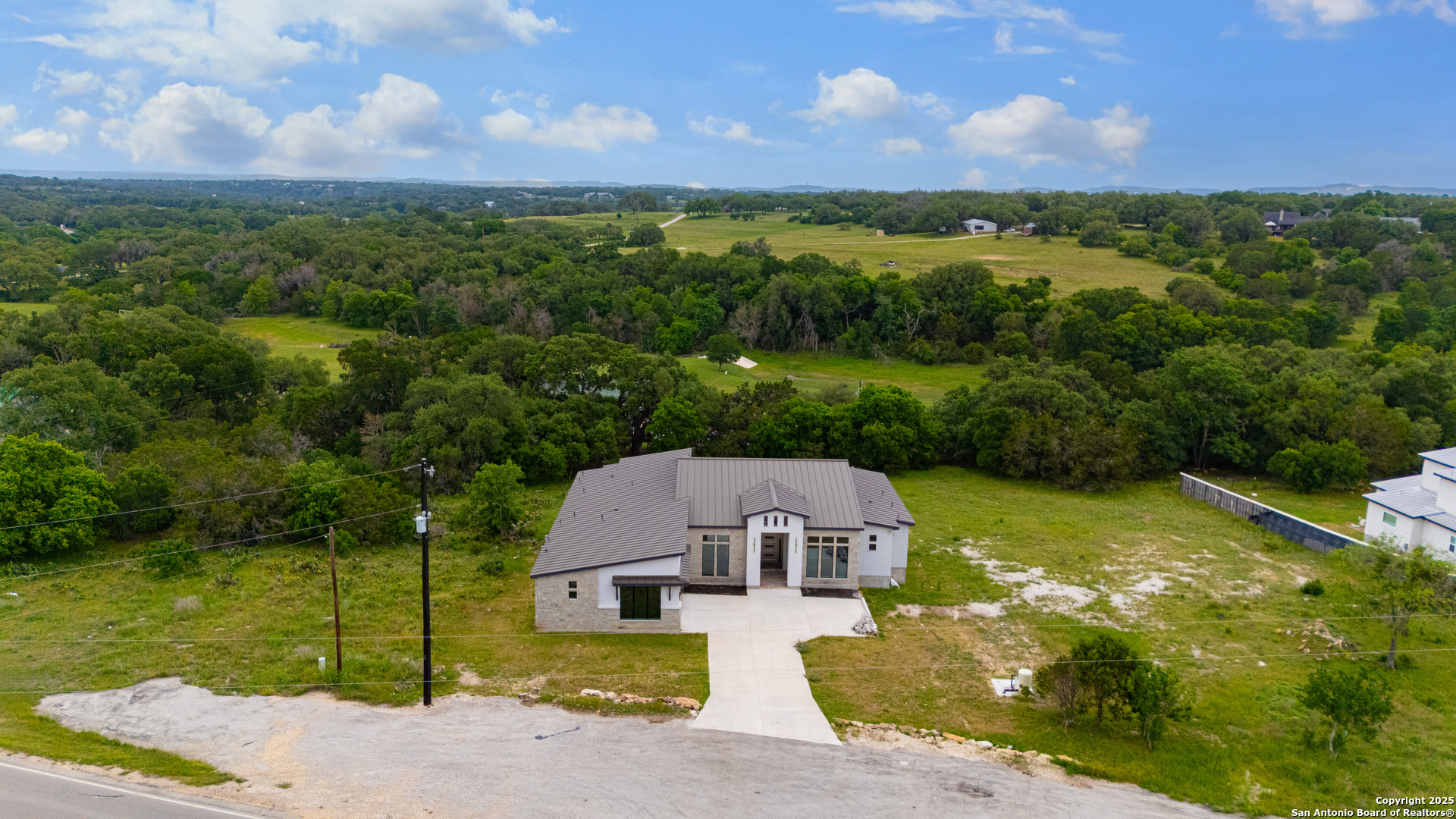 6846 Spring Branch Road Spring Branch, TX 78070 - Photo 40 of 46 a view of a house with a yard