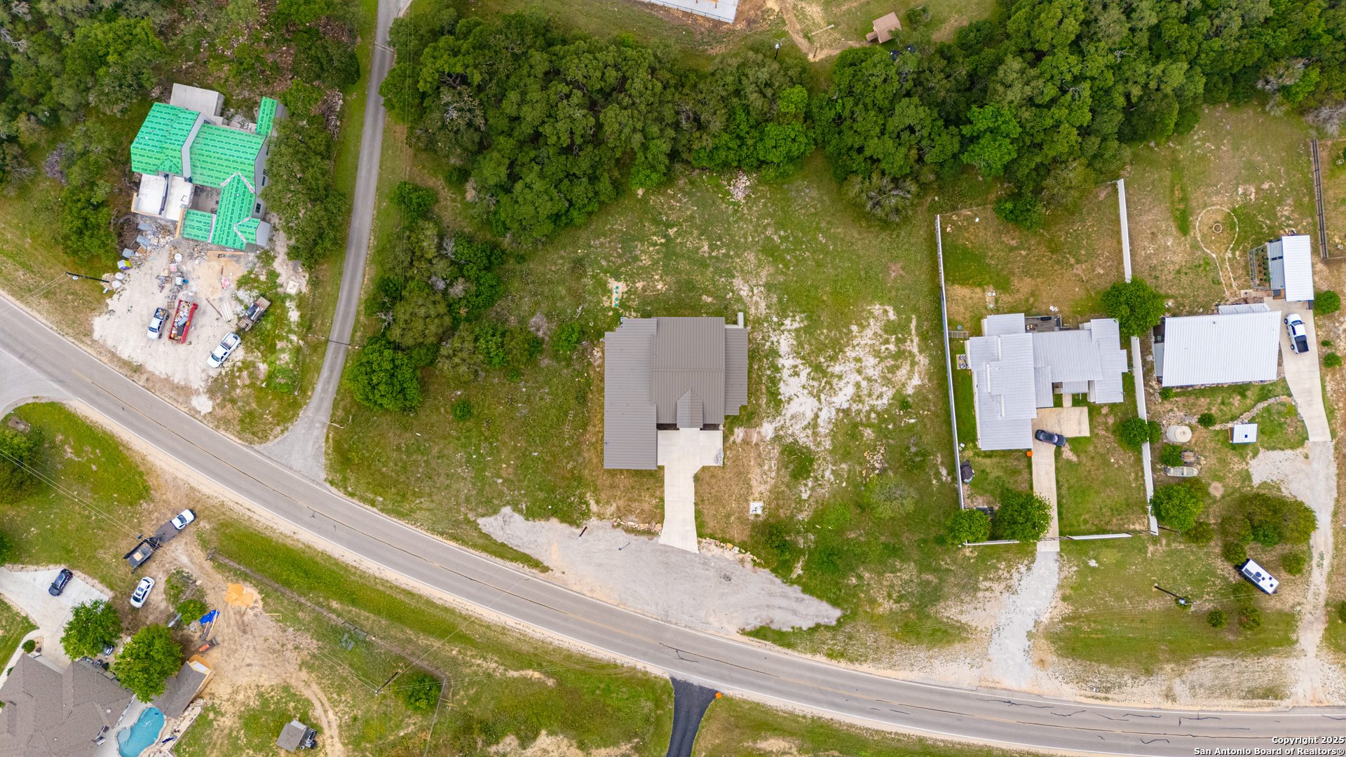 6846 Spring Branch Road Spring Branch, TX 78070 - Photo 43 of 46 an aerial view of residential houses with outdoor space