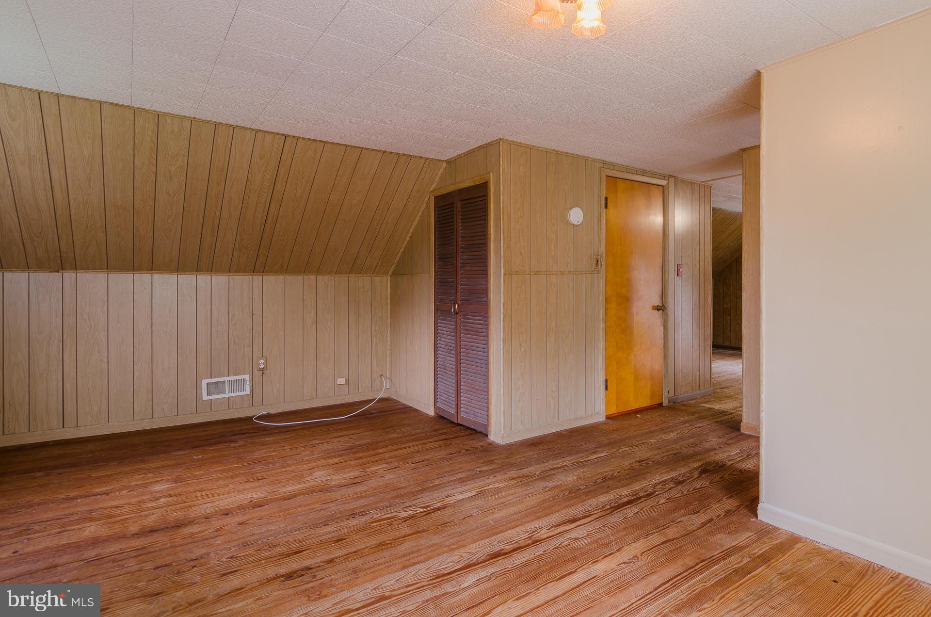 803 Bengies Road Baltimore, MD 21220 - Photo 22 of 30 an empty room with wooden floor and windows