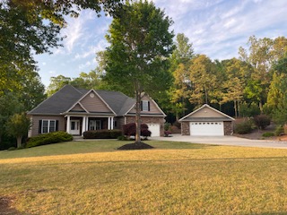 This charming residence offers ample living space and a welcoming exterior.