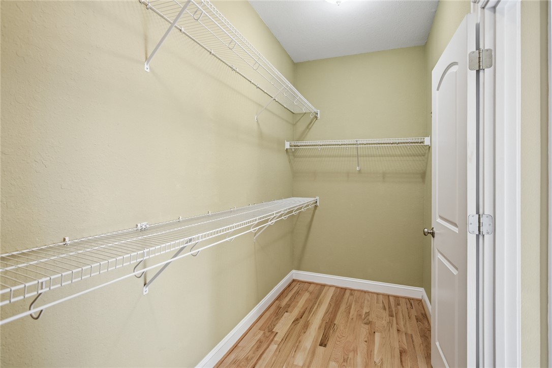 9069 Fairview Church Road Seneca, SC 29672 - Photo 21 of 48 Primary walk-in closet
with shelving.