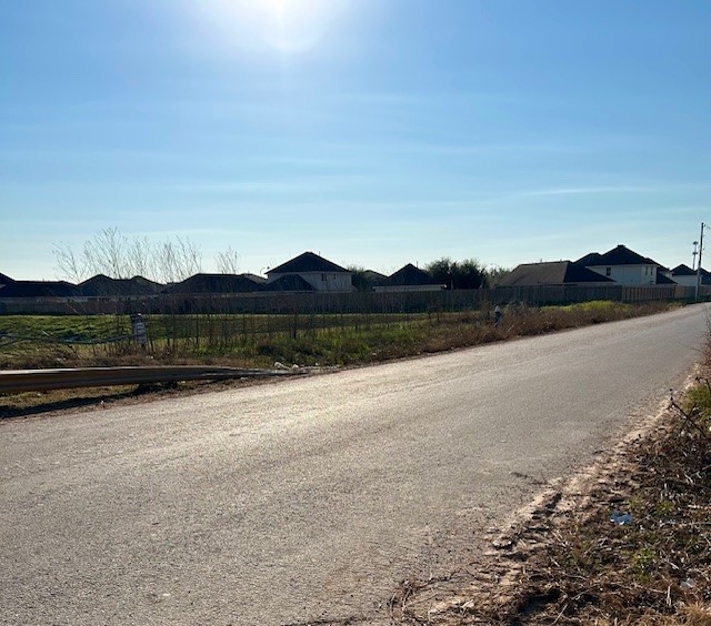 0 Selinsky Road Houston, TX 77048 - Photo 5 of 6 a view of a lake with mountain and trees
