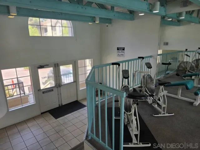 a view of gym equipment and windows