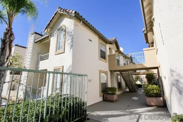 a view of a house with a small yard