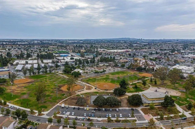 an aerial view of residential houses with outdoor space