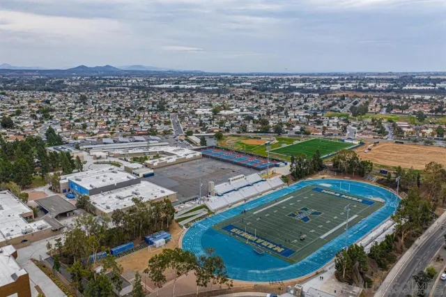 an aerial view of residential houses with outdoor space