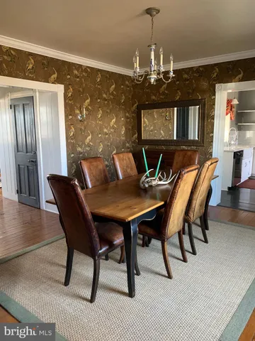 a view of a dining room with furniture