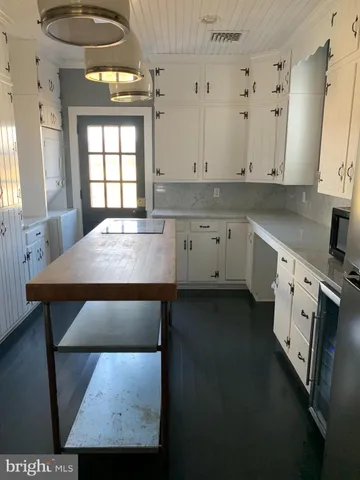 a kitchen with stainless steel appliances a stove a sink and a refrigerator