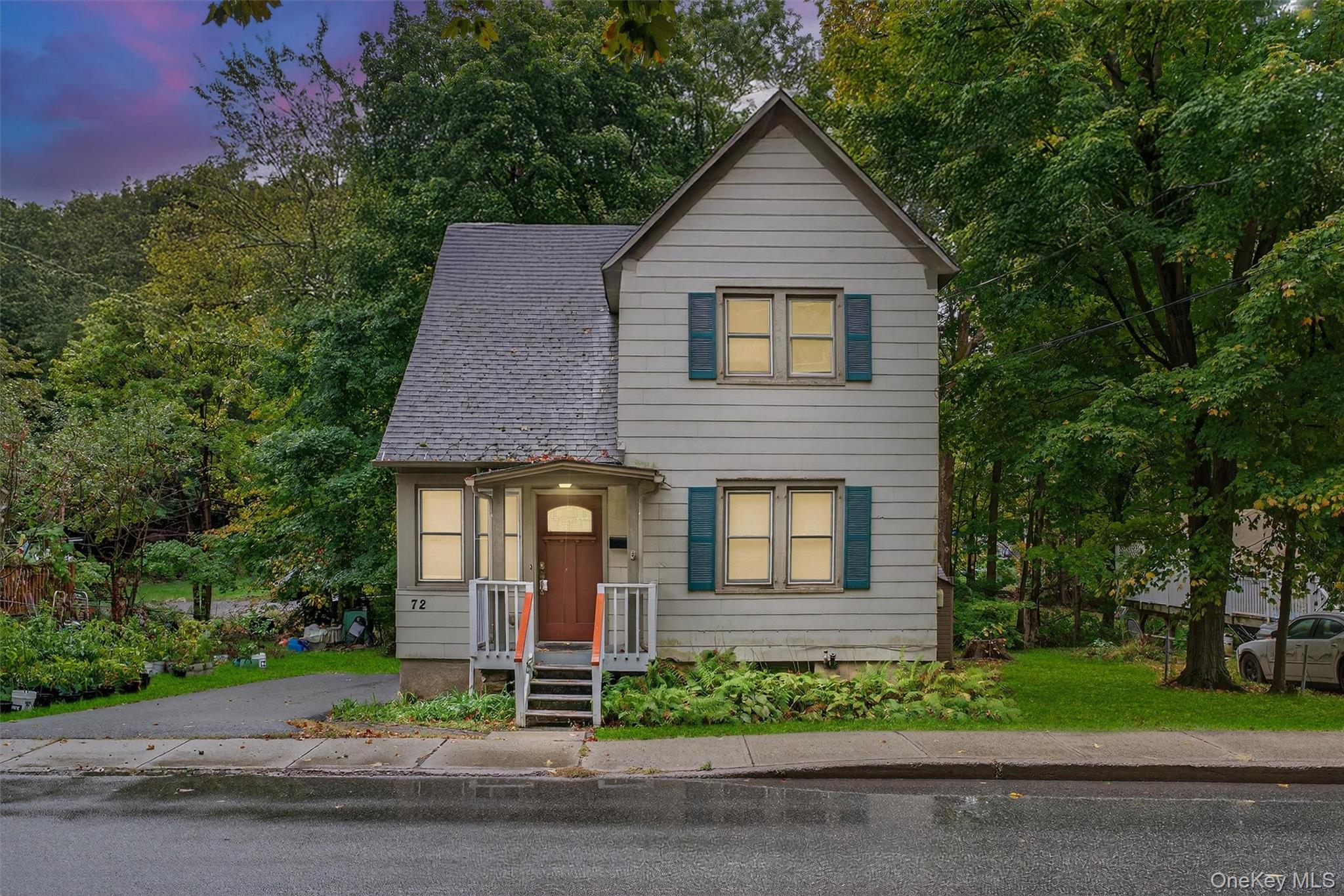 View of front of property featuring roof with shingles