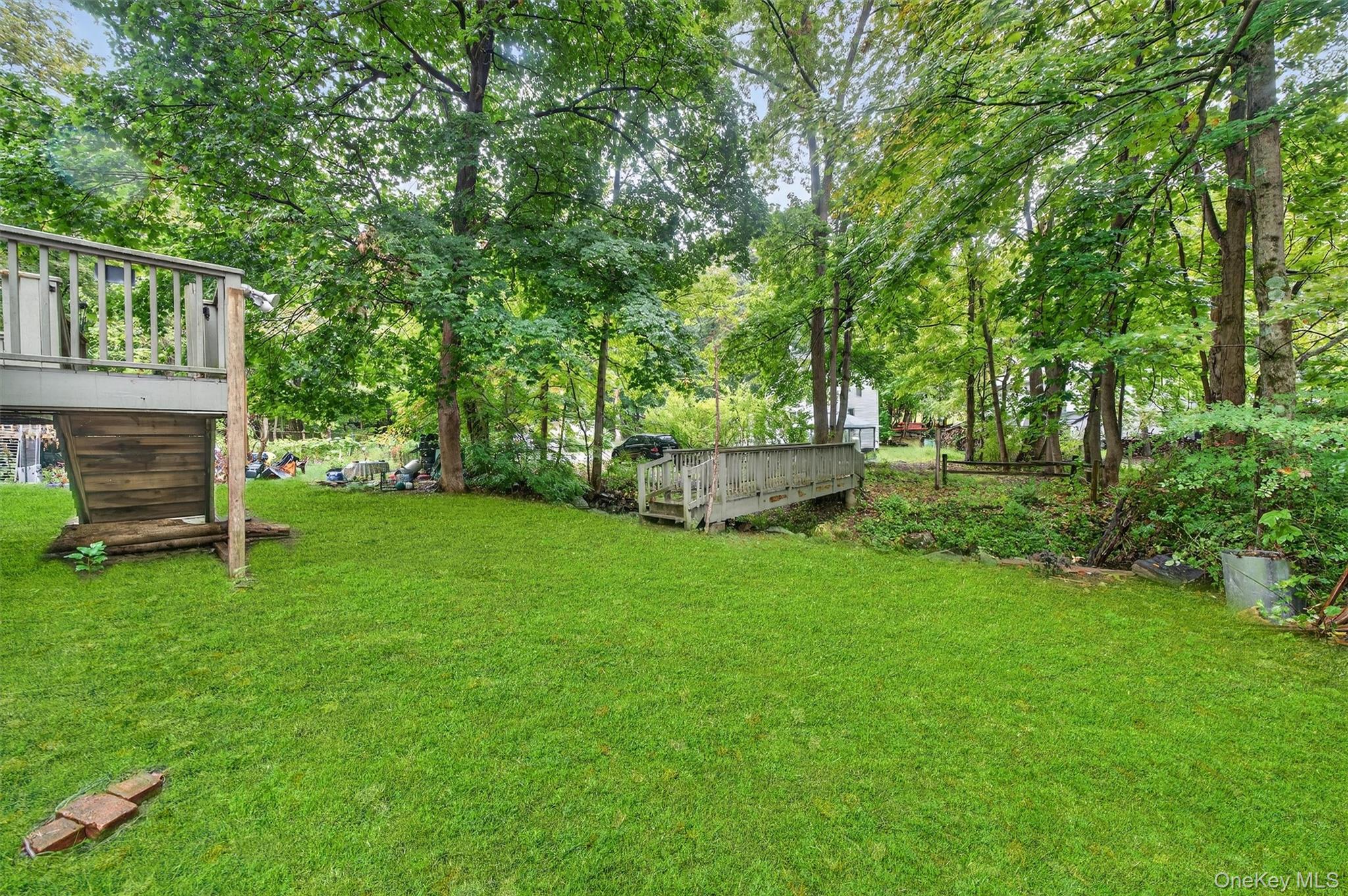 72 Smith Clove Road Central Valley, NY 10917 - Photo 29 of 35 View of green lawn featuring a deck and view of wooded area