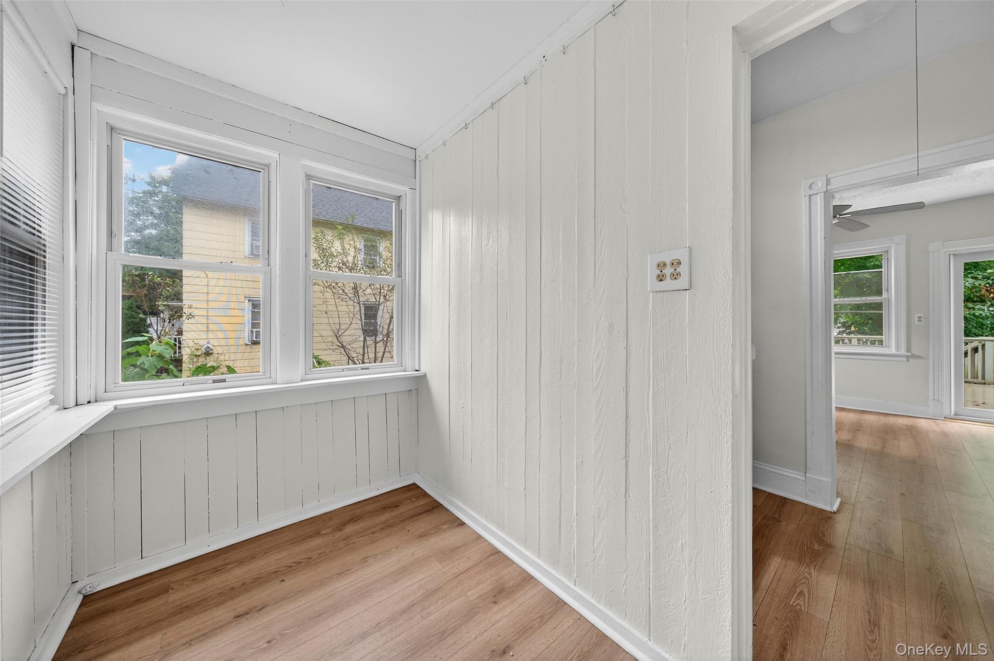 72 Smith Clove Road Central Valley, NY 10917 - Photo 4 of 35 Spare room with light wood-style floors, ceiling fan, and wood walls
