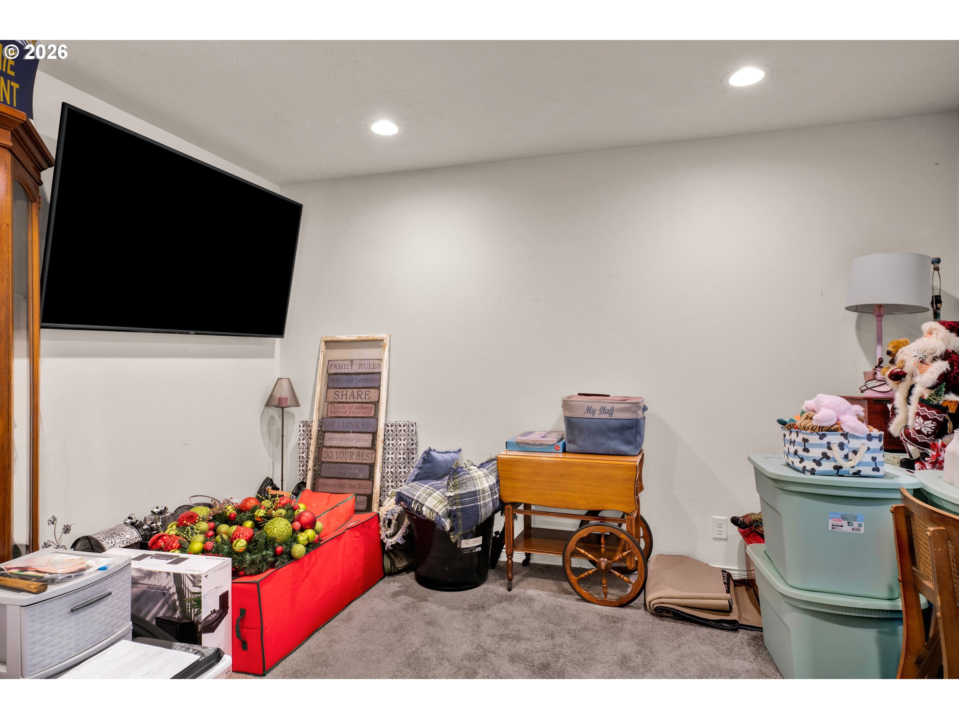 89555 Shorecrest Drive Florence, OR 97439 - Photo 12 of 24 a bedroom with furniture and a flat screen tv
