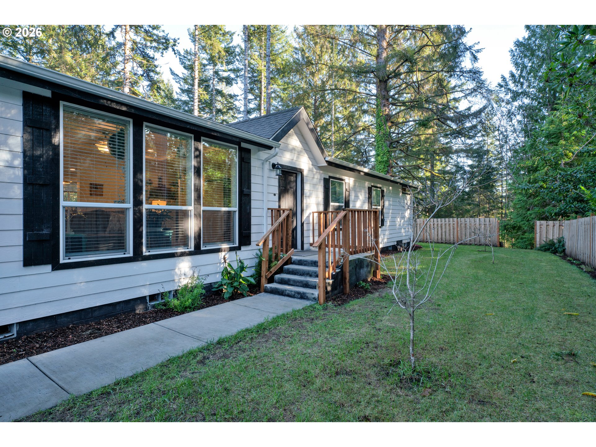 89555 Shorecrest Drive Florence, OR 97439 - Photo 17 of 24 a view of a house with backyard porch and sitting area