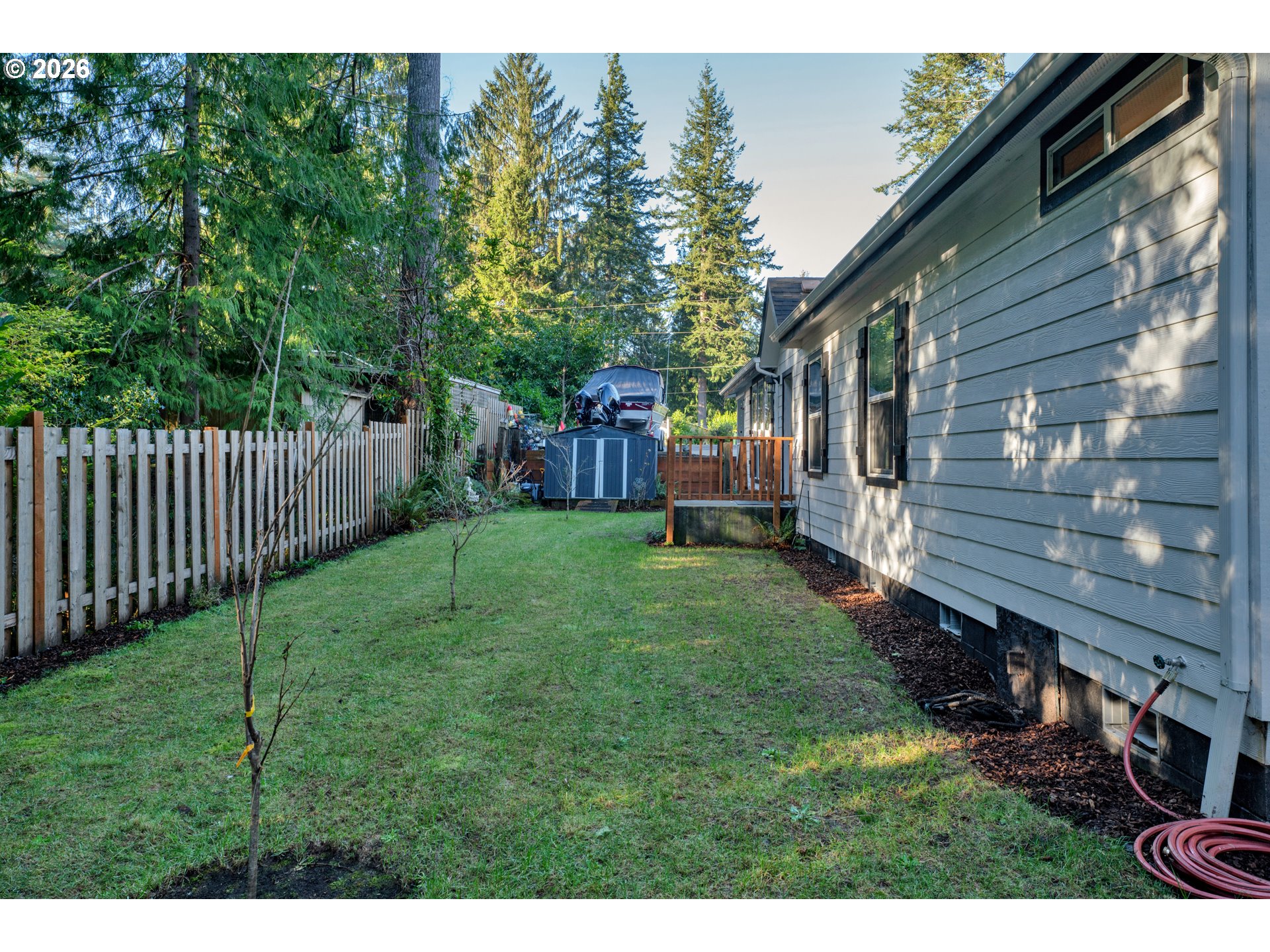 89555 Shorecrest Drive Florence, OR 97439 - Photo 18 of 24 a view of a backyard with a garden