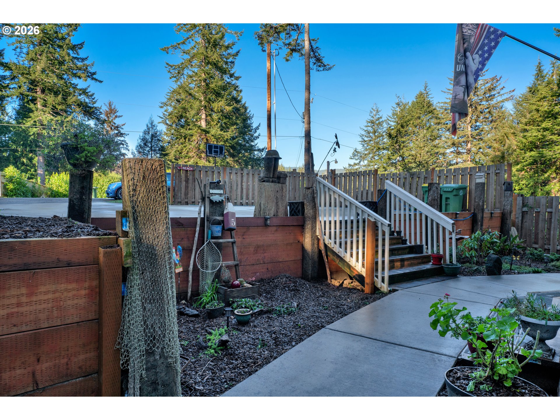 89555 Shorecrest Drive Florence, OR 97439 - Photo 5 of 24 a view of a house with backyard and sitting area