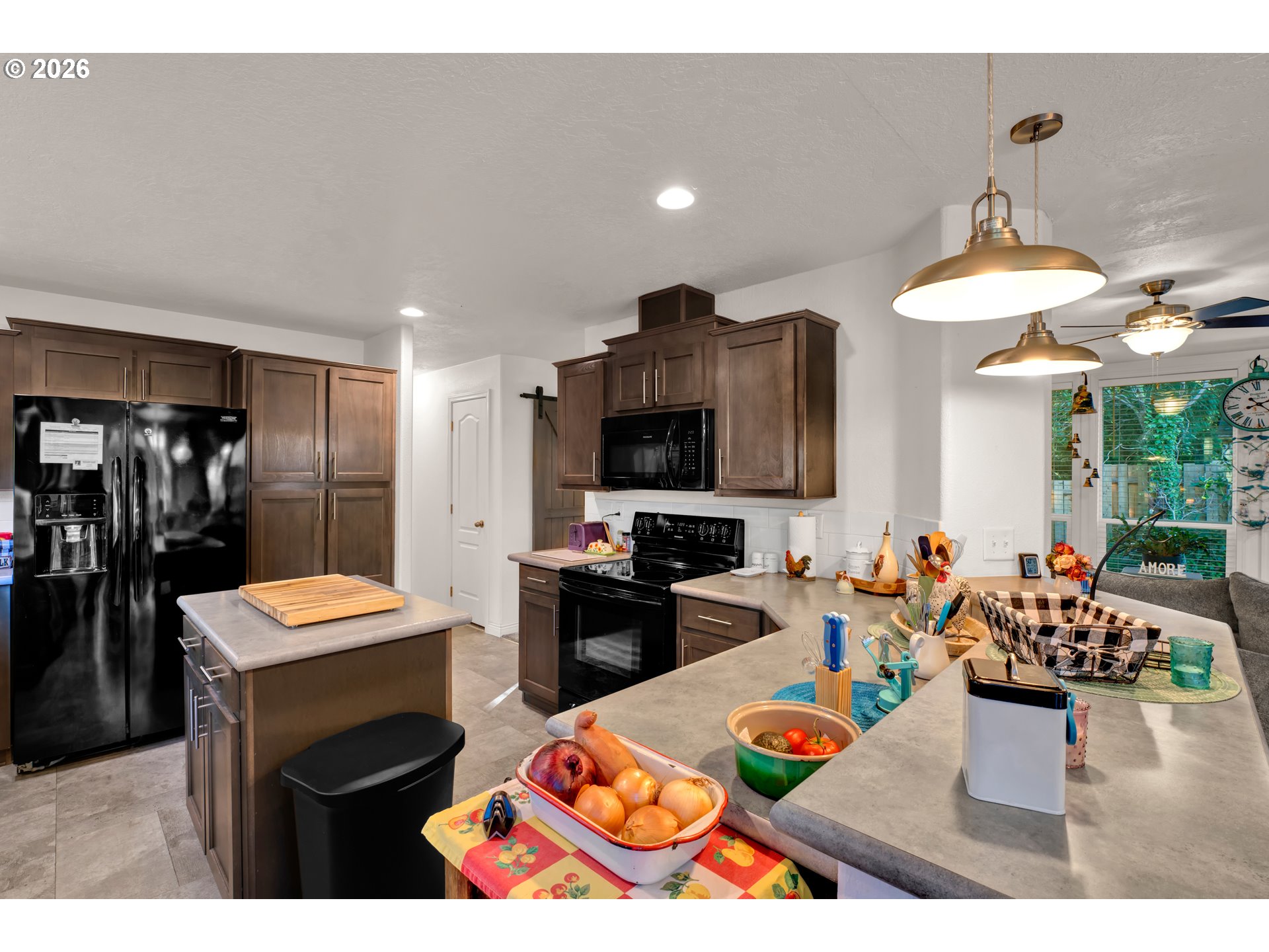 89555 Shorecrest Drive Florence, OR 97439 - Photo 10 of 24 a room with stainless steel appliances kitchen island granite countertop furniture and a kitchen view