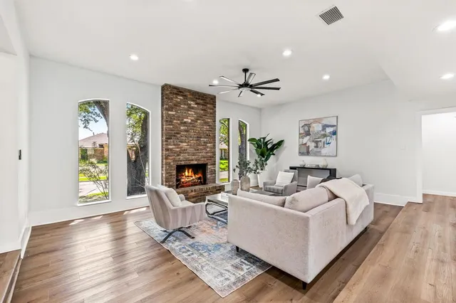 a living room with furniture and a fireplace
