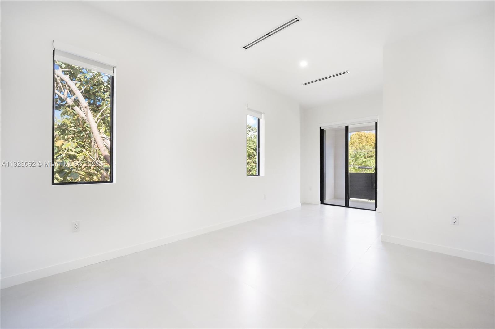 442 Southwest 15th Road Miami, FL 33129 - Photo 13 of 18 an empty room with windows and closet