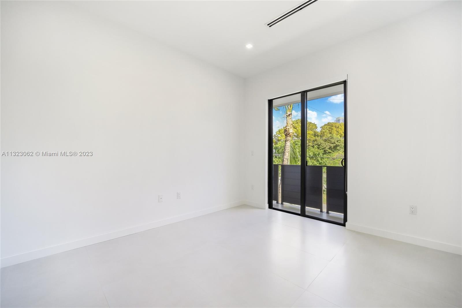 442 Southwest 15th Road Miami, FL 33129 - Photo 15 of 18 a view of an empty room with a window
