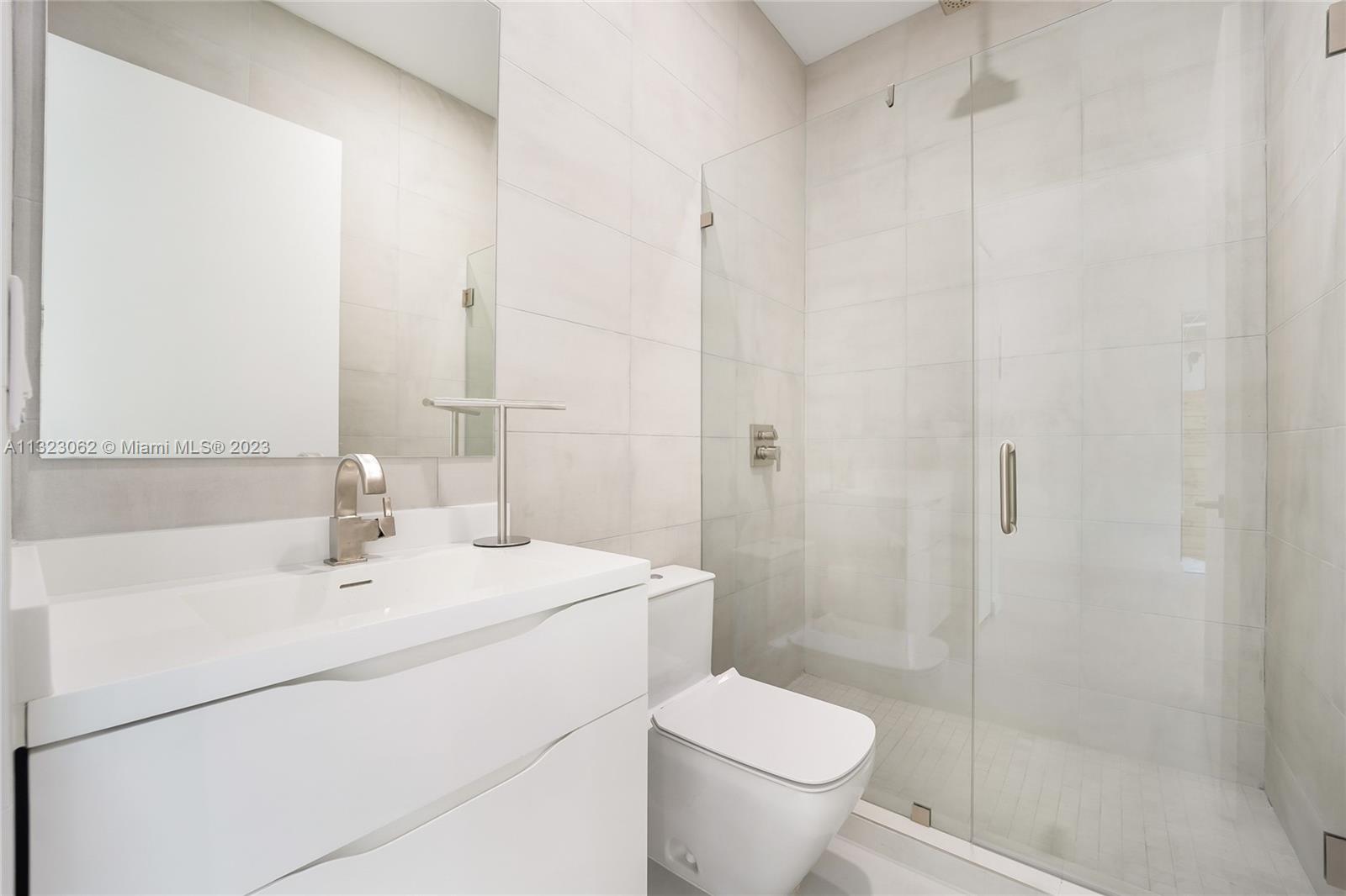 442 Southwest 15th Road Miami, FL 33129 - Photo 6 of 18 a bathroom with a sink toilet and shower