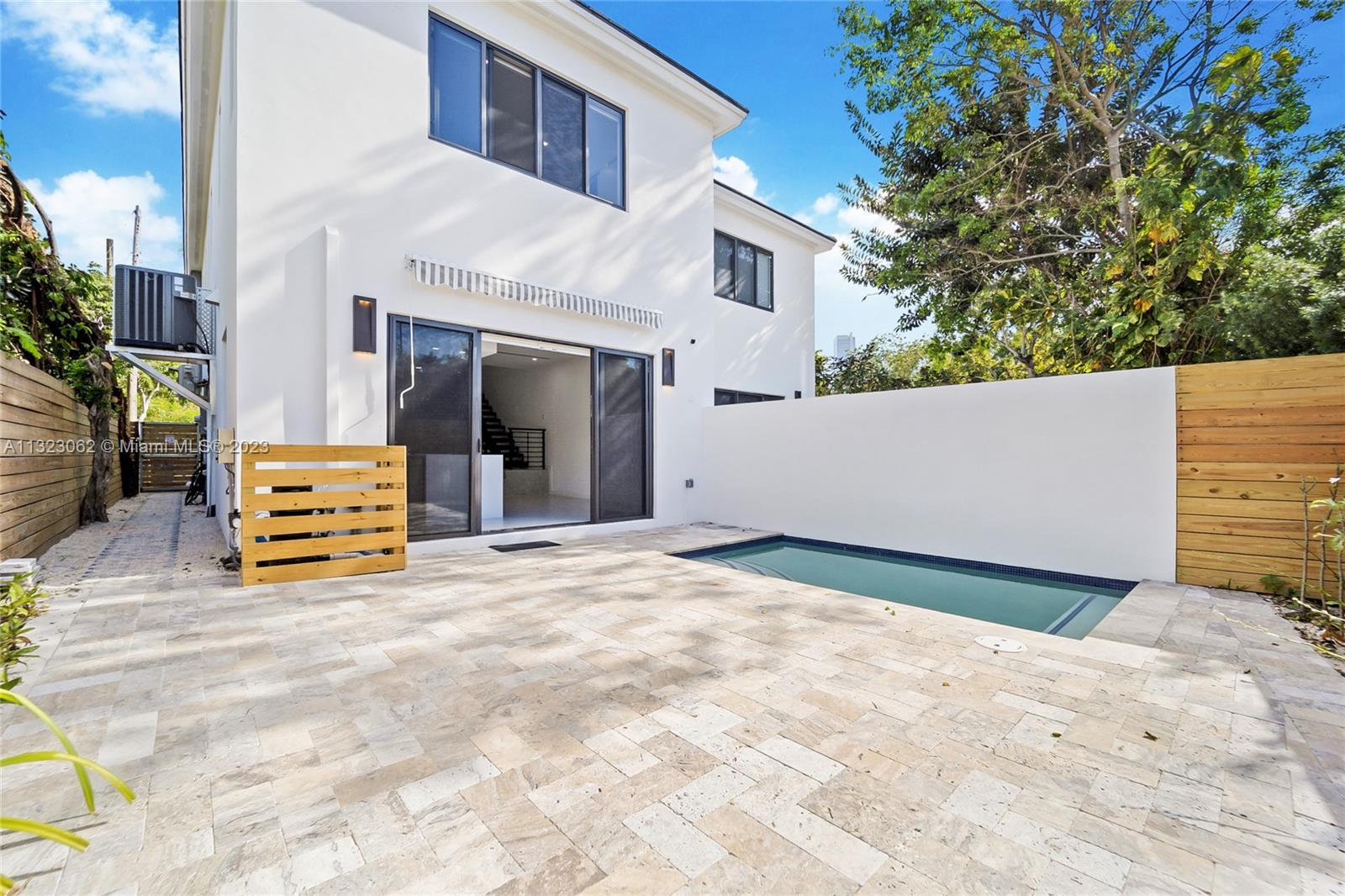 442 Southwest 15th Road Miami, FL 33129 - Photo 8 of 18 a view of an house with backyard and a tree