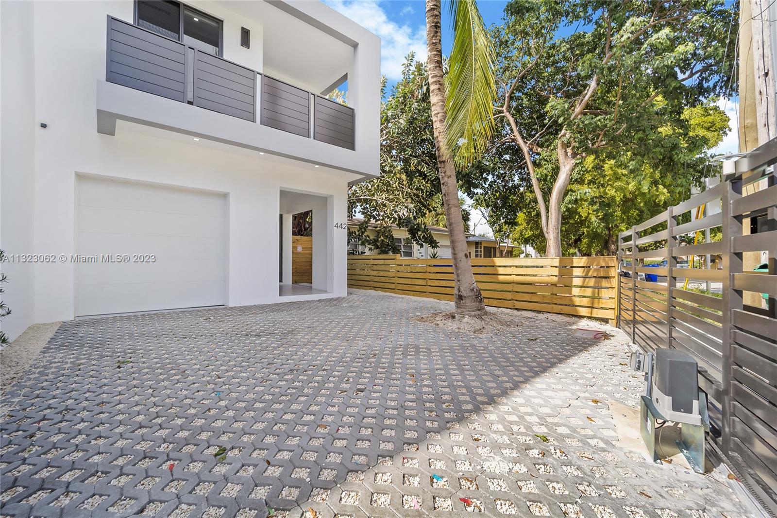442 Southwest 15th Road Miami, FL 33129 - Photo 9 of 18 a view of a brick house with many windows